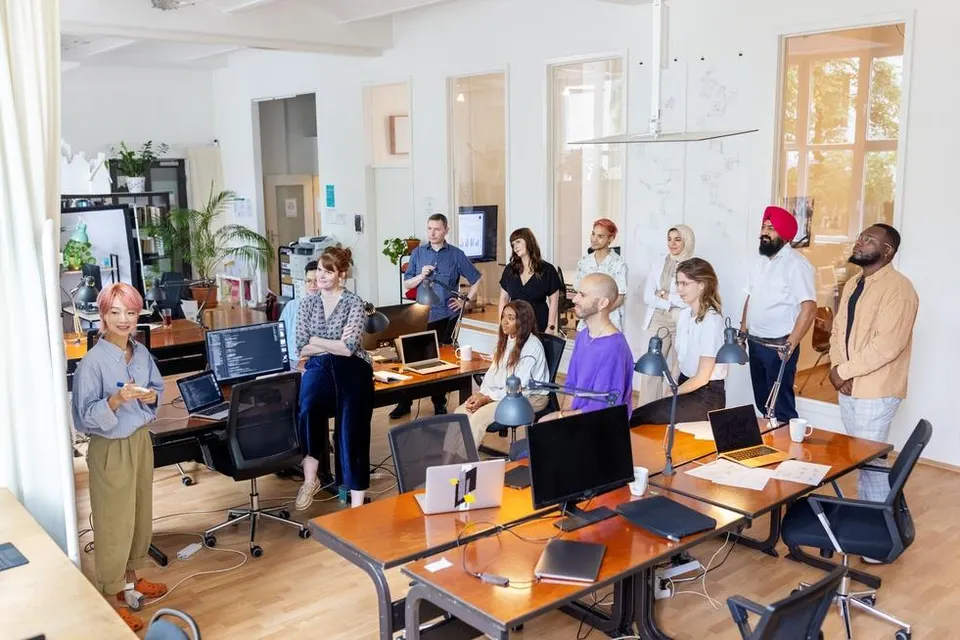 Diverse team collaborating on innovative tech solutions amidst evolving job landscape